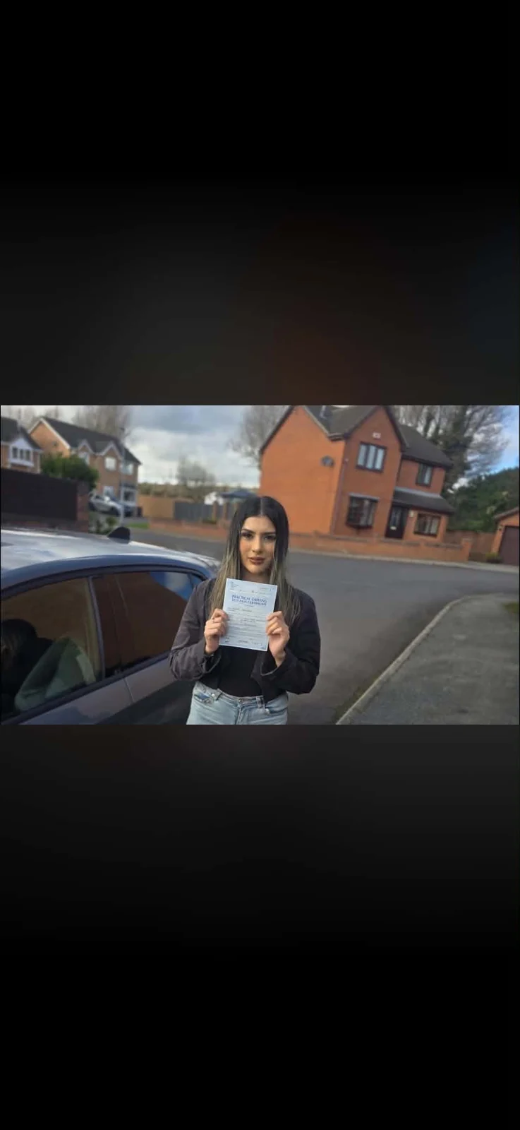 Savera celebrating a first-time driving test pass at Rotherham Test Centre